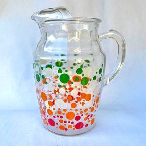 Vintage pitcher with multicolor dots pattern